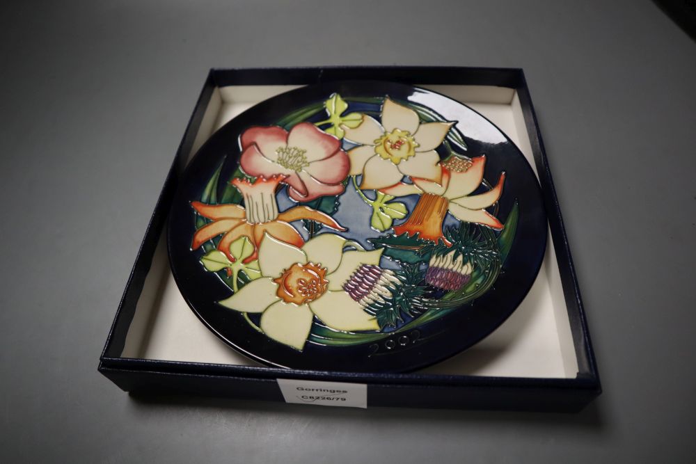 A Moorcroft Elizabeth II Golden jubilee 2002 plate, tube lined with flowers of the British Isles, designed by Emma Bossons,